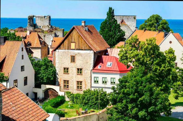 A panoramic view of the historic town of Visby, showcasing ancient architecture against the backdrop of the sea.