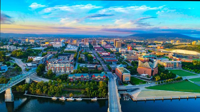 Drone aerial view of Downtown Chattanooga TN skyline, Coolidge Park, and Market Street Bridge