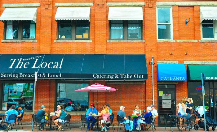 Local patrons enjoy dining at patio tables outside The Local in Marietta