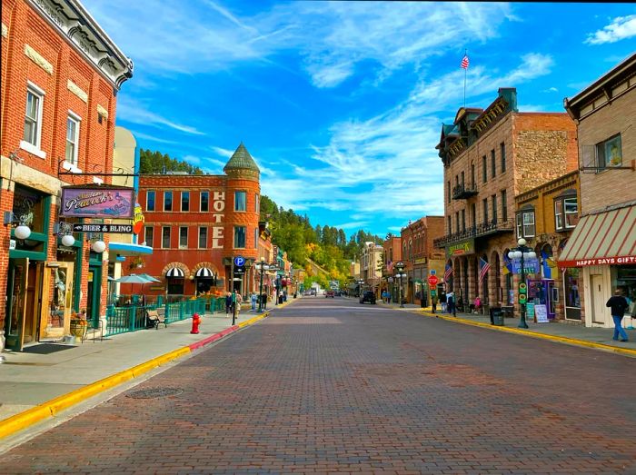 A bustling main street featuring shops, a saloon, and a hotel