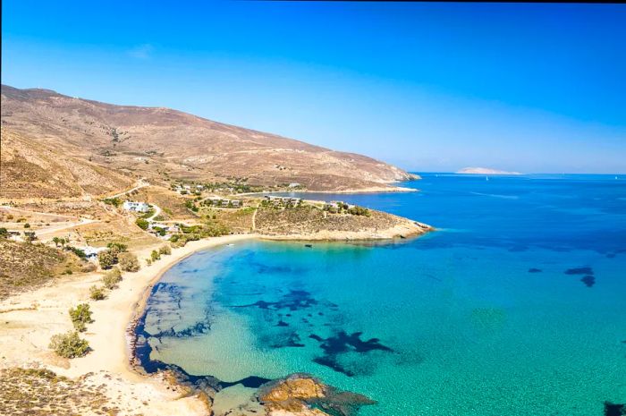 A secluded beach featuring clear turquoise waters.