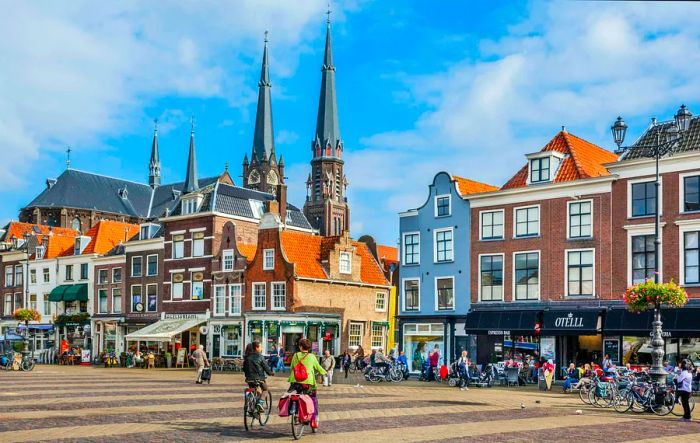 Delft's market square with the spires of the Maria van Jesse Church in the background