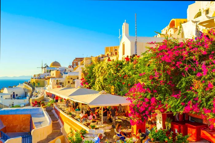 Terrace view with stunning panorama from a rooftop in Oia