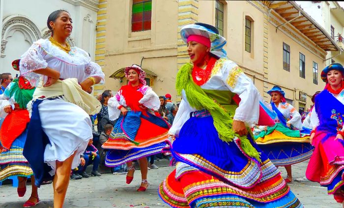 Dancers participating in a Christmas parade in Cuenca, Ecuador