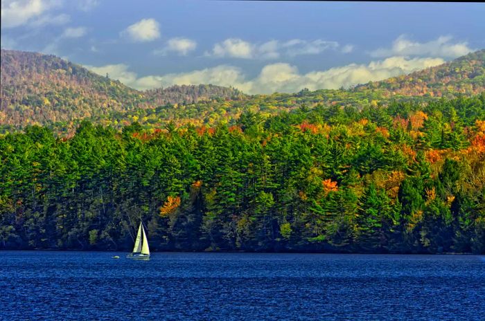 Sailboat gliding across Lake Champlain in Vermont.