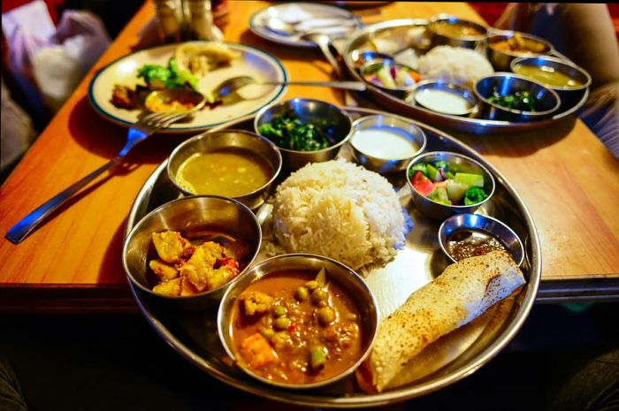 A serving of rice, vegetables, and lentil curry at a Nepalese restaurant