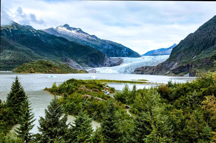 A path leads to a viewpoint overlooking the glacier