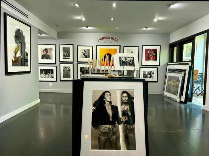 A photograph of Cher at the Morrison Hotel Gallery, showcasing an impressive collection of iconic rock and pop culture photography at the Sunset Marquis Hotel, West Hollywood, California, USA