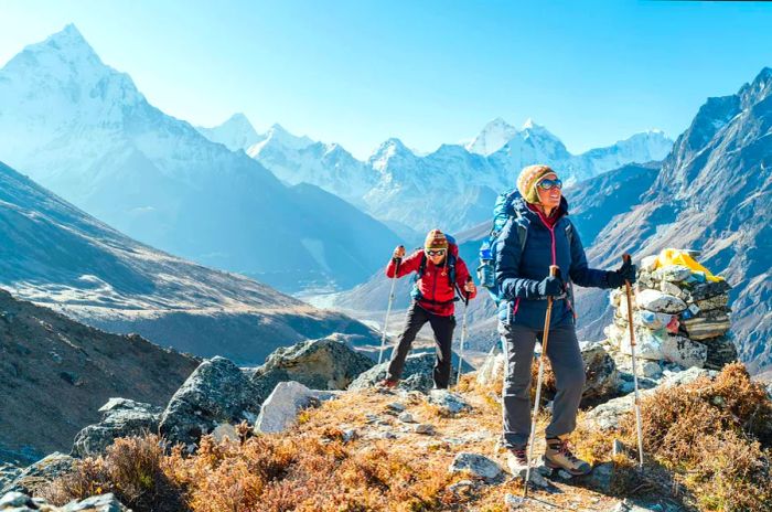 A couple trekking towards Everest Base Camp near Dughla (elev 4620m), Nepal