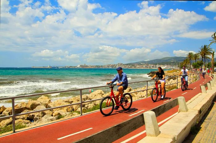 Cyclists enjoying the seafront in Palma de Mallorca