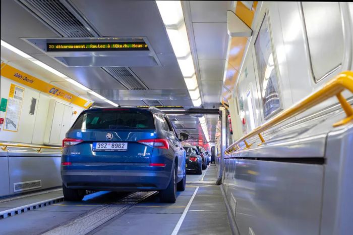 Cars are lined up bumper to bumper inside a Eurotunnel train.