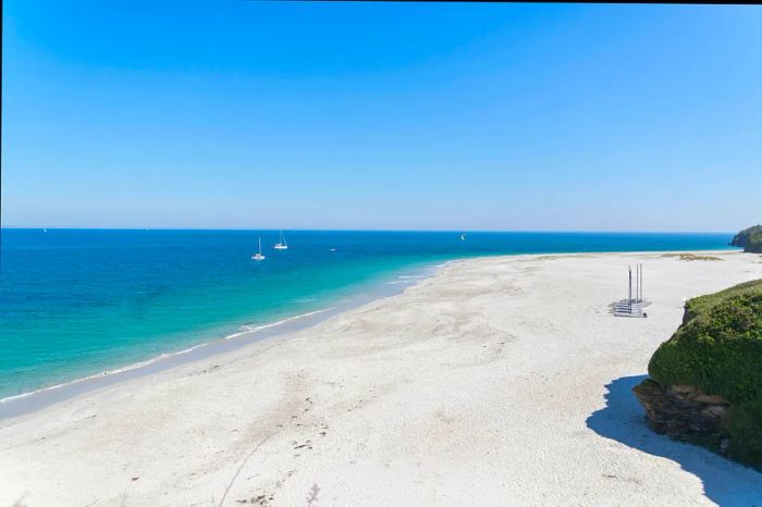 Extensive stretch of white sand at Plage des Grands Sables in Brittany, France.