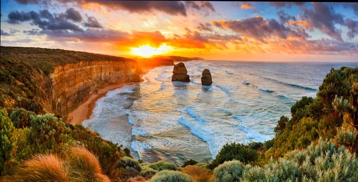 Two of the Twelve Apostles rock formations against the sea, Great Ocean Road at sunset