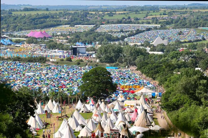 Aerial view of the Glastonbury Festival site with fields of tents in 2022