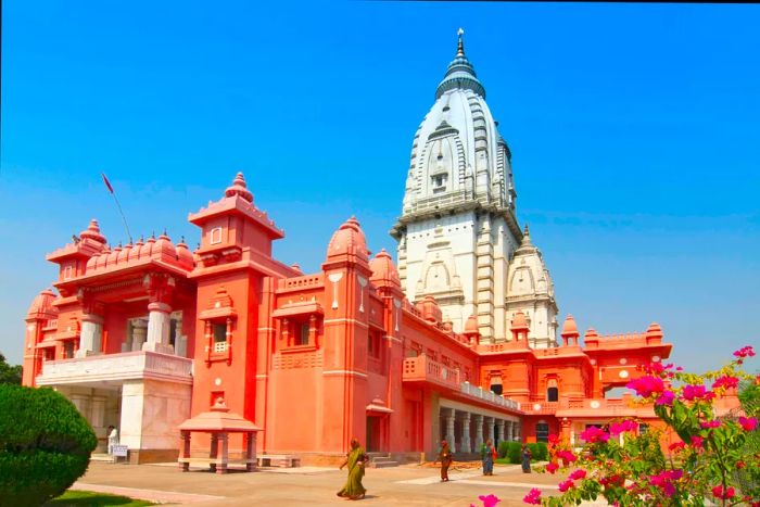 A red-orange temple with a white tower on its summit