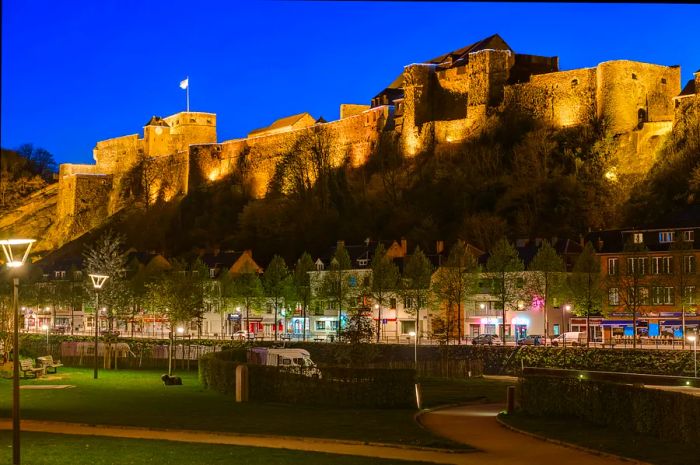 A scenic view of the village and the illuminated Bouillon Castle, Ardennes, Belgium, Europe