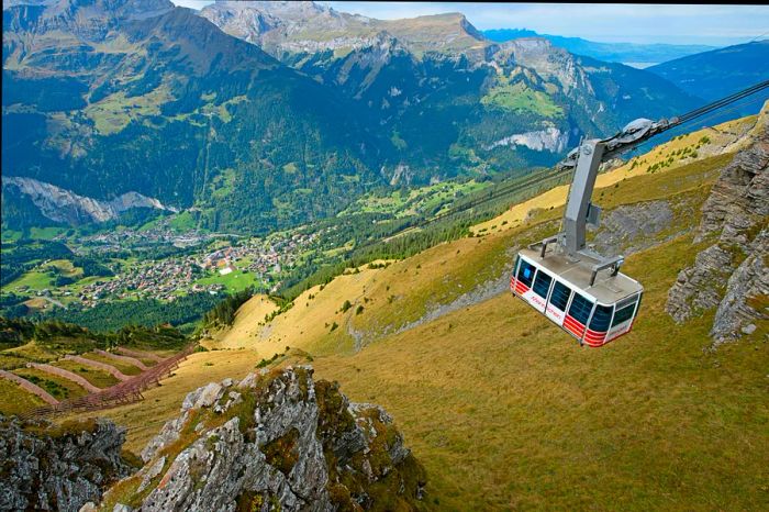 A cable car soars high above the Lauterbrunnen Valley in Switzerland.