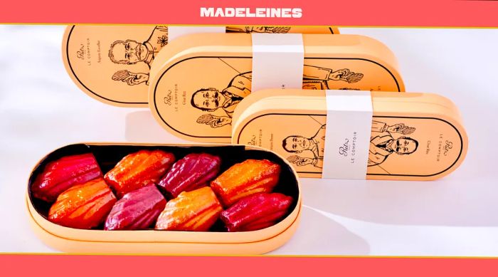 A wooden box filled with assorted flavored madeleines