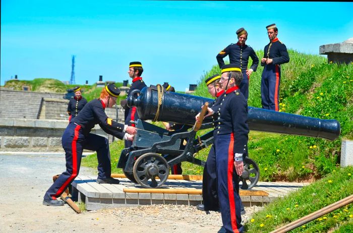 Soldiers in traditional uniforms fire the noon cannon at Citadel Hill (Fort George), Halifax, Nova Scotia, Canada