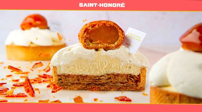 A Saint-Honoré pastry cut in half reveals its gooey caramel center and cream topping.