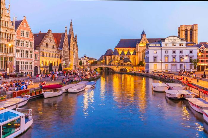 Historic houses along Ghent's River Leie at dusk