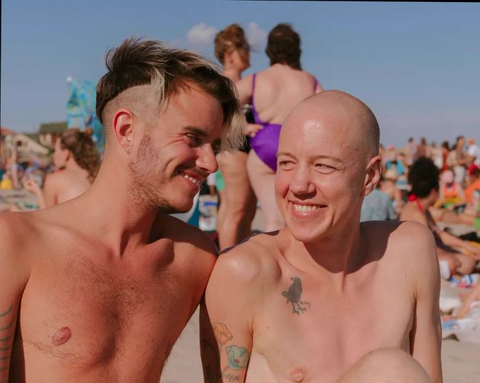 An LGBT couple enjoying the sun at Jacob Riis Park, Rockaway Beach, Queens, New York City, New York, USA