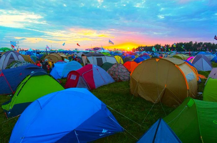 A sea of tents at a festival during sunset © Anton Gvozdikov / Shutterstock