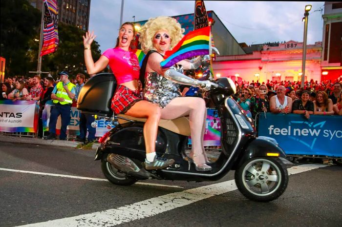 A drag queen riding a motorcycle during the Sydney Gay & Lesbian Mardi Gras, Sydney, New South Wales, Australia