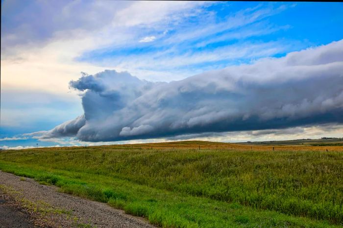 Dark clouds loom over the prairie