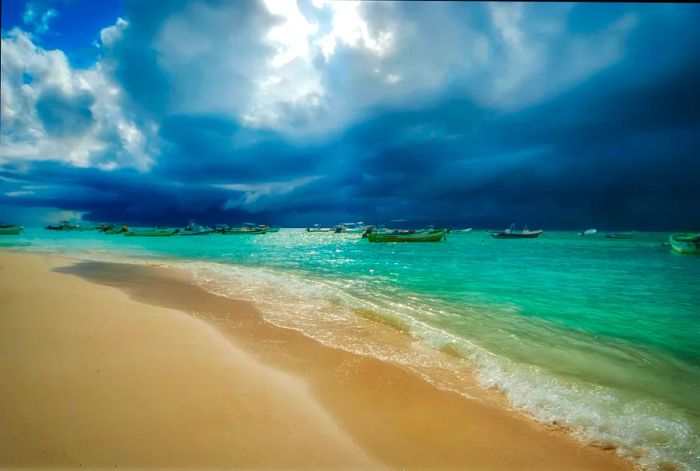 Dark clouds loom over the beach from the ocean