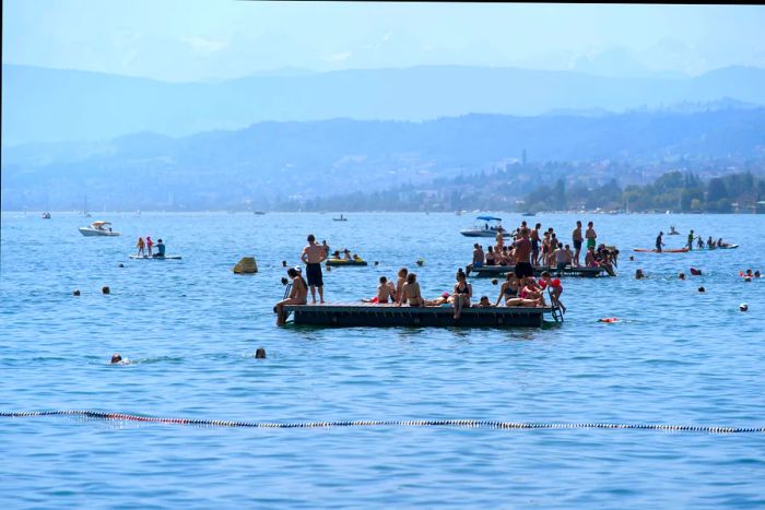 Enjoy swimming and sunbathing on floats at Lake Zürich, Switzerland