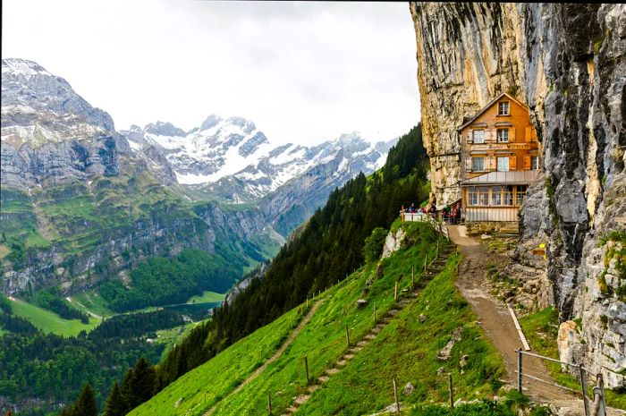 A Swiss structure nestled against the mountains of Switzerland.