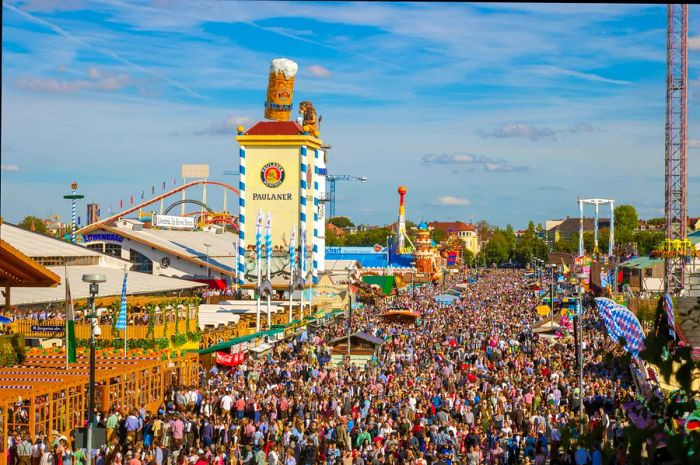 A lively crowd enjoying a beer festival on a sunny day