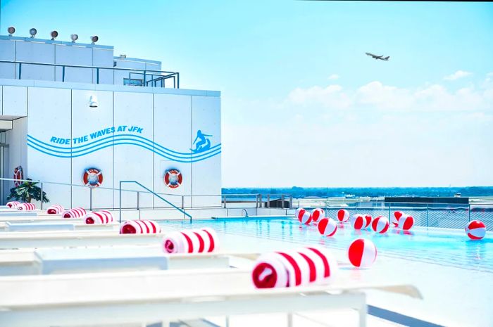 The infinity pool at the TWA Hotel’s rooftop provides a stunning view of JFK Airport