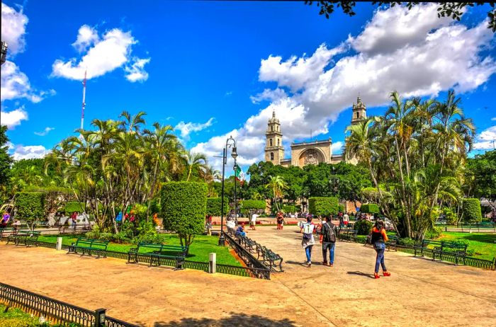 Visitors strolling through Mérida's historic center on a sunny day