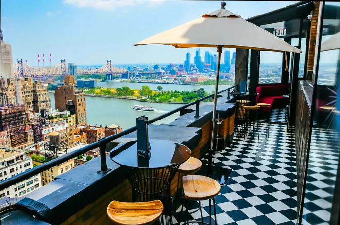 Views of the East River and Roosevelt Island from Ophelia Lounge