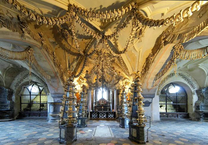 The interior of Sedlec Ossuary (Kostnice) is adorned with skulls and bones.