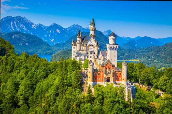 A majestic castle perched on a cliff, surrounded by mountains and lush forests