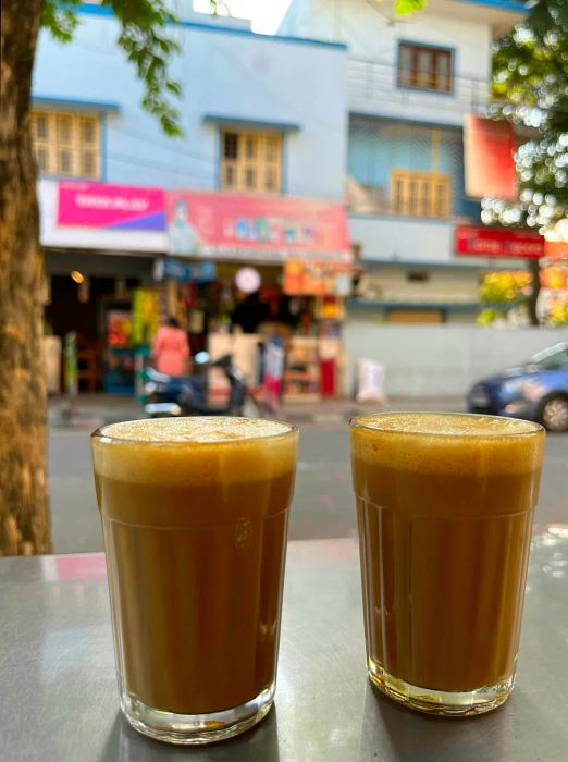 Two cups of filter coffee elegantly served at an outdoor table