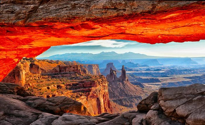 A breathtaking view through Mesa Arch at sunrise in Canyonlands National Park