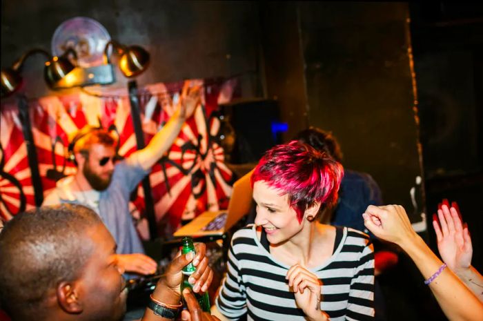 Trendy young people dancing at a Berlin party.