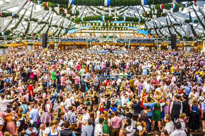 Oktoberfest in Munich: A view of the grand beer tent, with a band performing in the background.