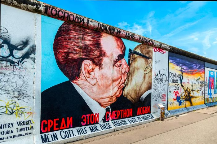 Detail from Berlin's East Side Gallery featuring Leonid Brezhnev and Erich Honecker kissing