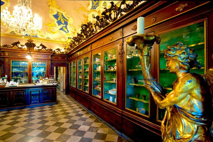 A spacious room adorned with towering wooden cabinets displaying antique apothecary artifacts.