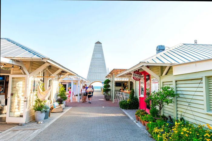 Visitors stroll through a charming seaside shopping area