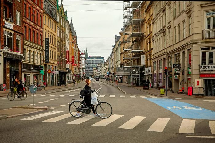 A woman riding her bicycle along Vesterbrogade in Copenhagen