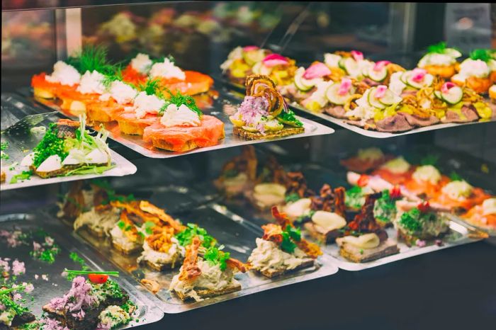 A traditional Danish smørrebrød, an open sandwich, showcased at a food market in Copenhagen