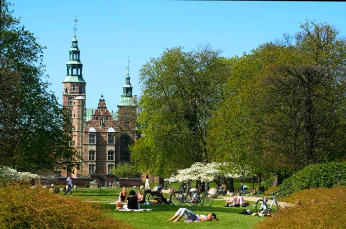 Visitors unwinding in the gardens of Rosenberg Slot, Copenhagen