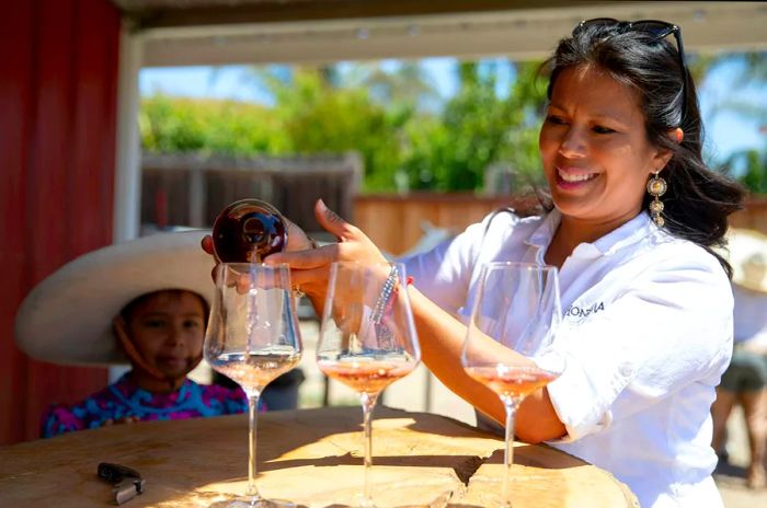 Miriam Puentes serves Paula’s Rosé at Honrama Ranch in Napa, California.