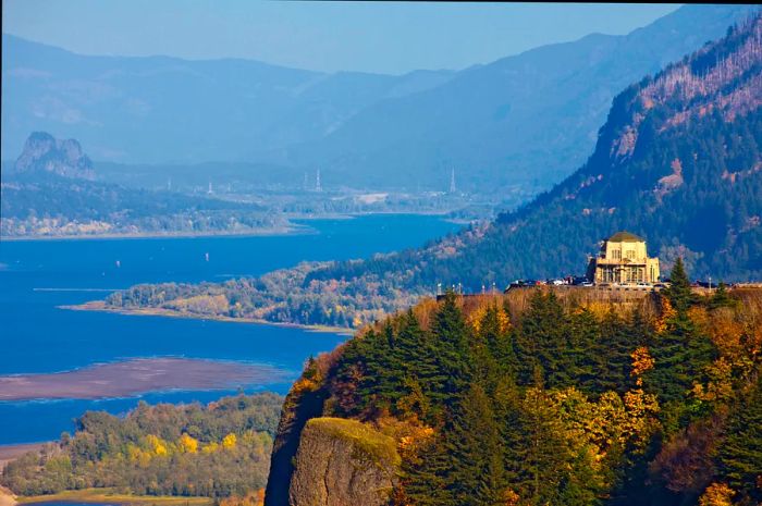 An aerial perspective of Crown Point Vista House with cliffs that overlook the Columbia River, Multnomah County, Oregon, USA